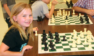 Kid Chess student smiling for camera